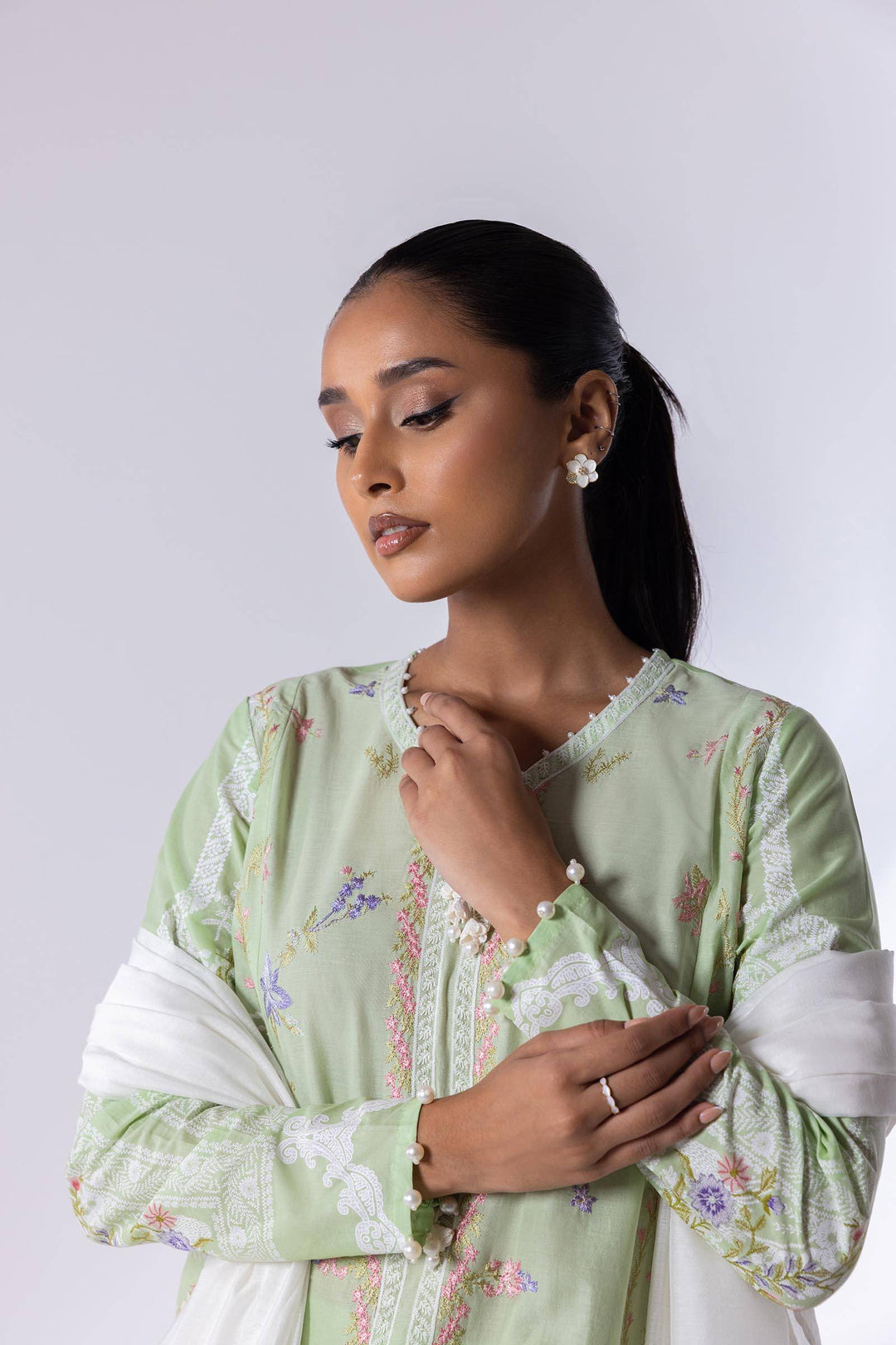 Close-up of SANA SAFINA Embroidered Lawn Suit showing delicate neckline embroidery and soft lawn fabric. Elegant and breathable design.