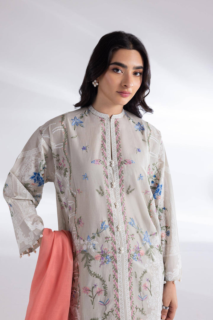 Close-up of SANA SAFINAZ Lawn Suit showcasing intricate floral embroidery on beige shirt with coral chiffon dupatta, perfect for elegant occasions.