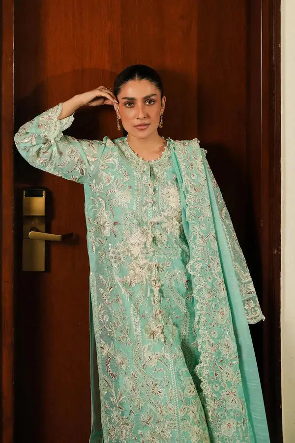 SANA SAFINA green party wear dress with embroidered shirt, dupatta, and culotte pants, showcasing premium craftsmanship and festive appeal.