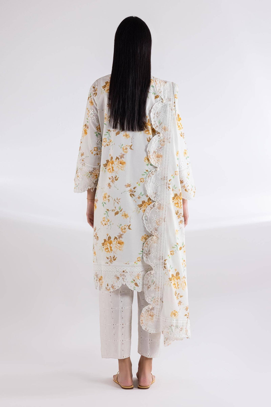 Back view of SANA SAFINA embroidered lawn suit with floral print and lace-detailed dupatta. Includes matching culotte pants for a graceful look.