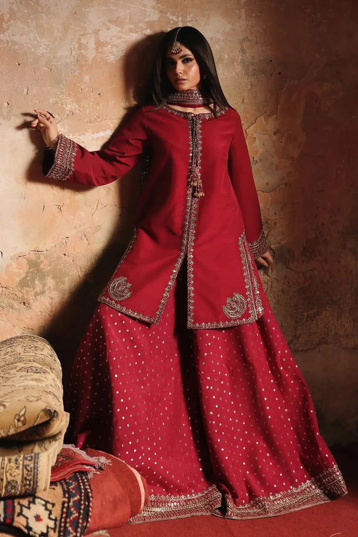 Red embroidered raw-silk suit with intricate gold embellishments and wide-leg pants