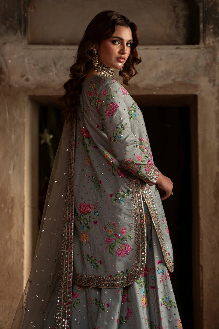 Embroidered silk suit with floral patterns and sequin embellishments